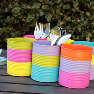Colourful cutlery holders made from tin cans