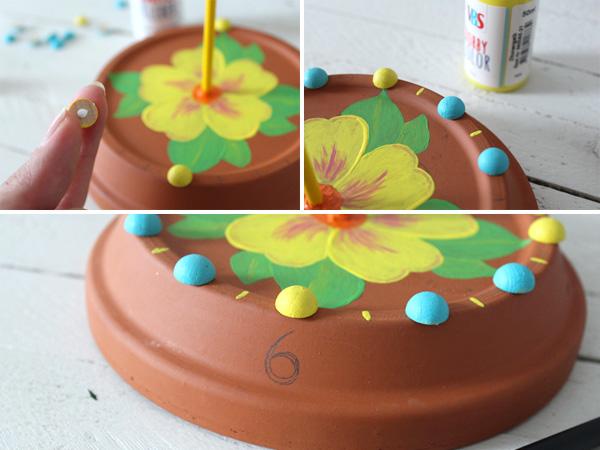 Painting the numbers on the edge of the saucer
