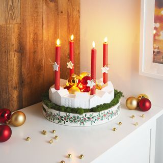 Häuser-Adventskranz gießen